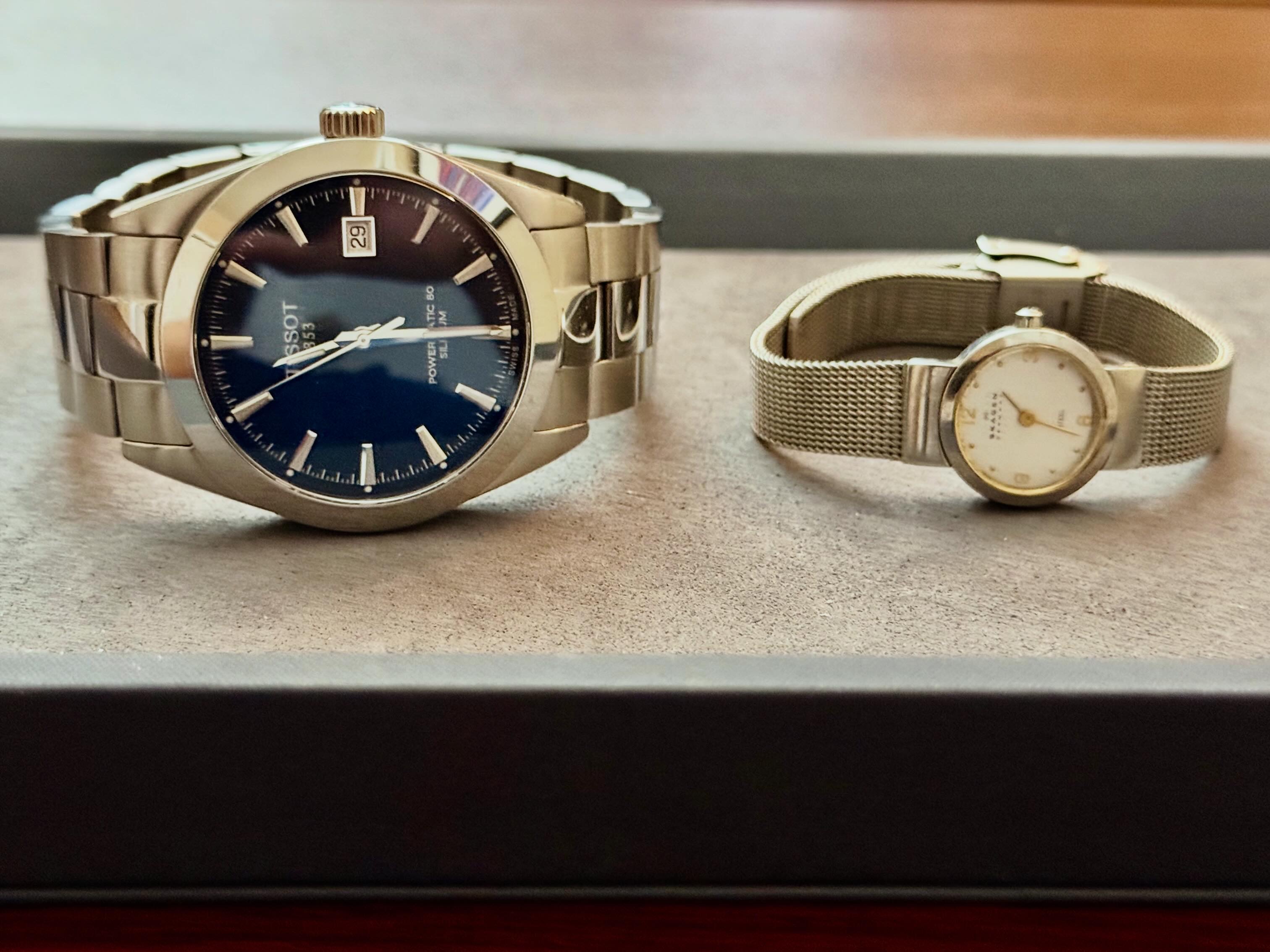 Skagen and Tissot watches shown together
